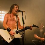 Joel of Airbourne on stage at Portsmouth Pyramids, November 2013