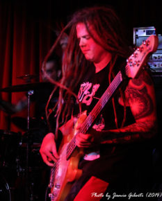 Ben Edis, new bassist of Breed77 with his hair flying, on stage at The Borderline, London, March 2014